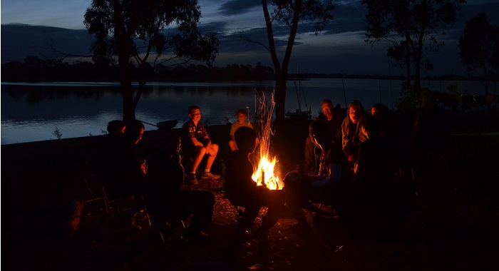 Campfire by the lake at night